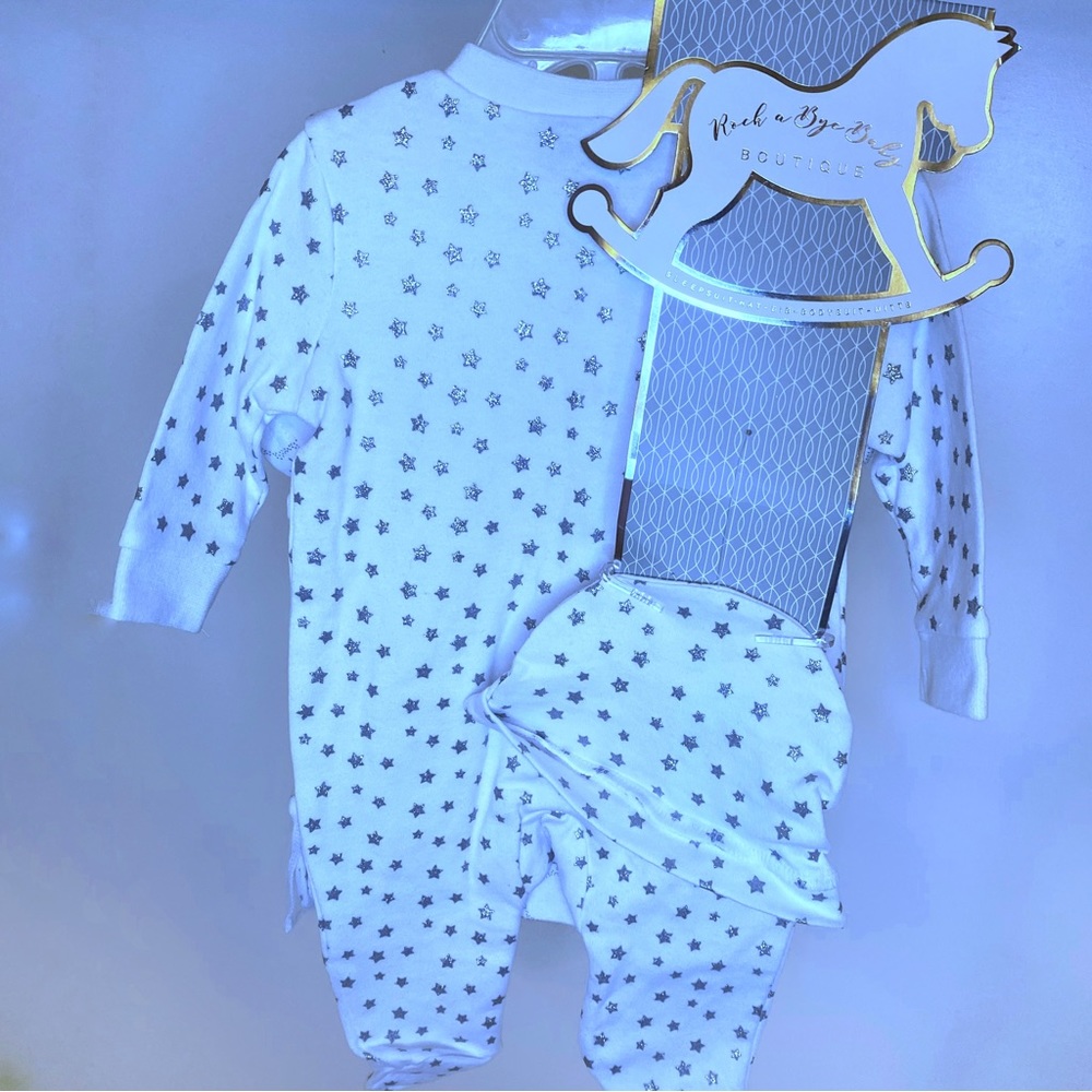 set that includes a footie, a bodysuit, a bib, a beanie and mittens